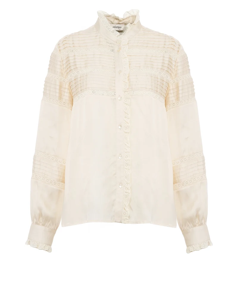 Blusa con dettagli con volant